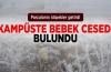 Kampuste bebek cesedi..Karda köpekler parçalamış