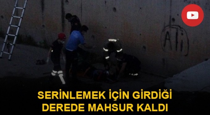 Serinlemek için girdiği derede mahsur kaldı