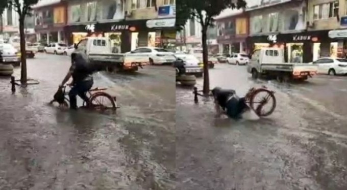 Bursa'da yağmurlu havada bisiklete bindi! Olanlar oldu