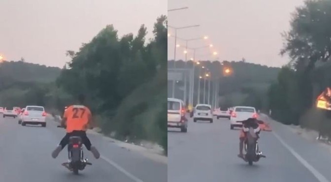 Bursa'da motosikleti yatarak kullandı! Trafiği tehlikeye soktu