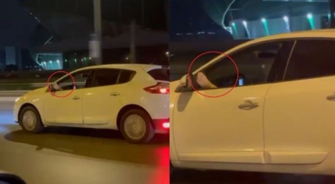 Bursa'da sıcaklar sürücüleri de bunalttı. Ayağını camdan sarkıtarak araç sürdü