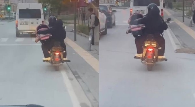 Bursa'da motosiklet sürücüsü pes dedirtti!  Bebeği pusette taşıdı