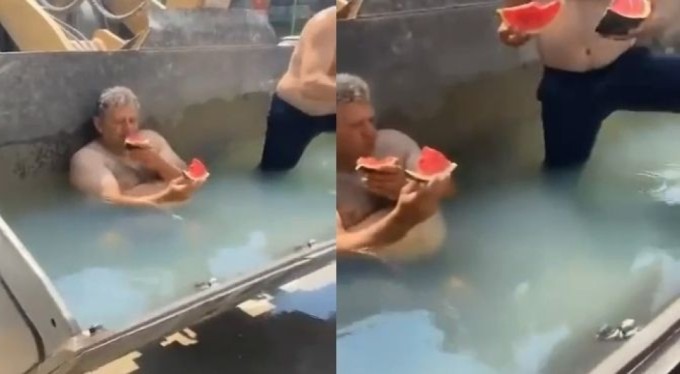 Bursa'da sıcaktan bunalan işçiler, kepçeyi havuza çevirdi